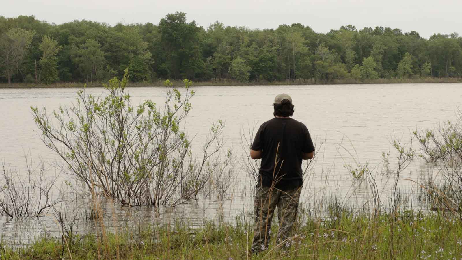 Man fishing on rural Oklahoma land